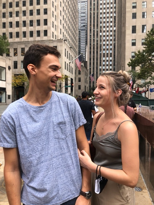 Michal and Austin in a city plaza