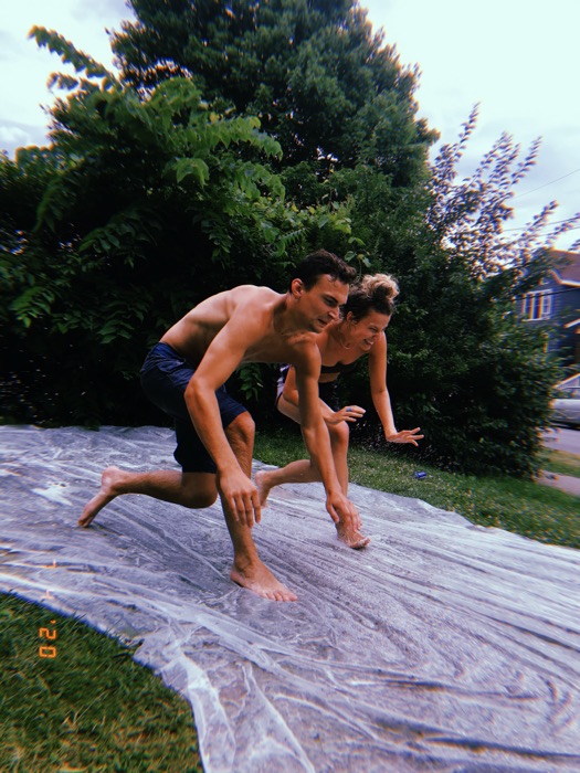 Michal and Austin on a slip and slide