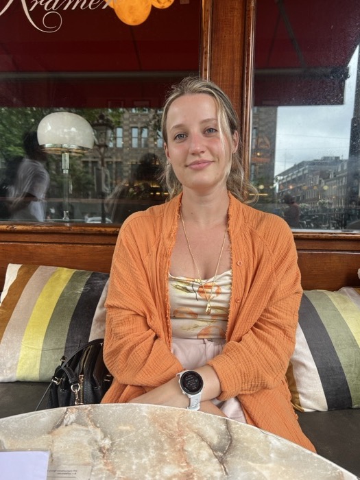 Michal smiling at a restaurant